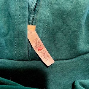 Maternity breast feeding sweatshirt with hood, and zip pocket.